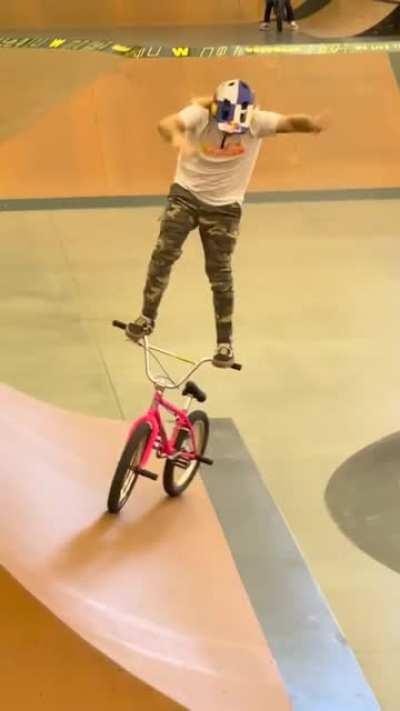 Catching some waves while surfing his bike.