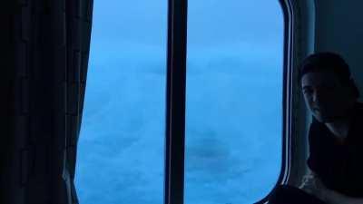 A cruise ship caught in huge waves and 120MPH (193 Km/h) winds. View from the third deck.