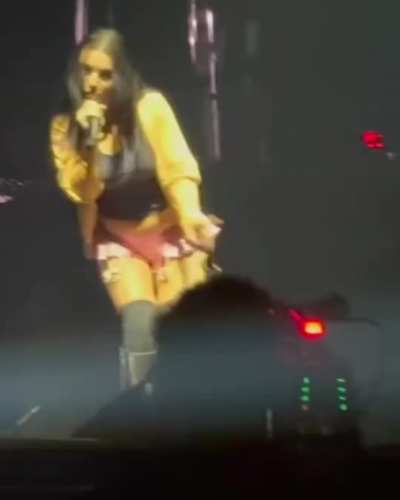 Shaking her ass in short pink skirt