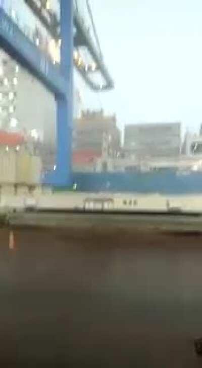 Crane crashes into ship by result of the wind force. Happened today in Santa Catarina, Brazil.