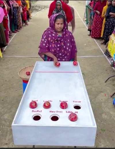 This village plays a table game for Basic Needs