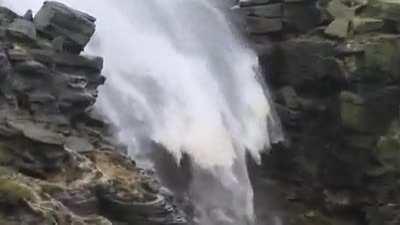 🔥 A waterfall being blown backwards by high winds