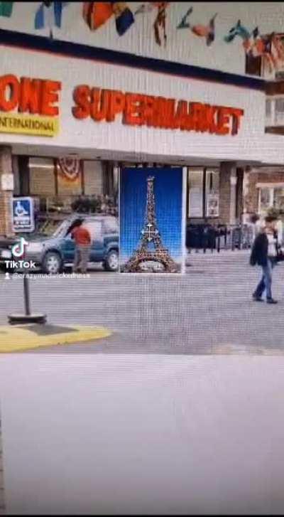 After a long day of work, the Eiffel Tower goes to the grocery store and then home to rest.