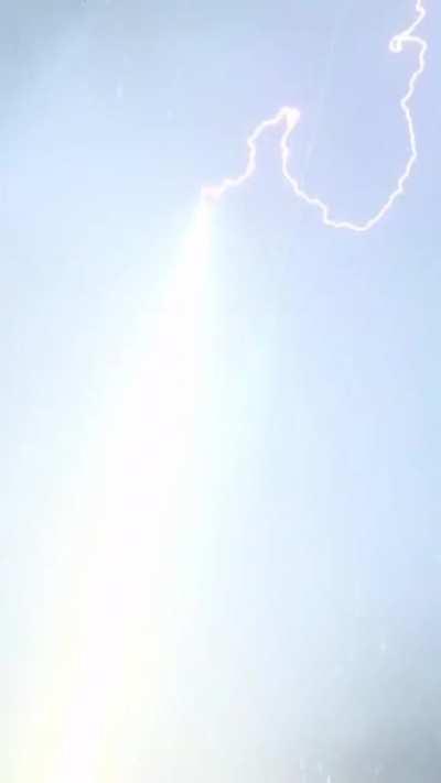 Lightning Bolt Is Guided To Ground Through Rocket Trail