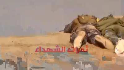 Iraqi volunteer chilling in the middle of battlefield fully exposed to bullets gets shot and instantly killed then dragged later by his comrades, during the battle to brake siege of Amerli by Iraqi armed civilians.2014.