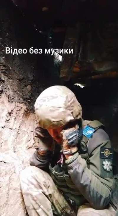 A Russian artillery shell nearly hits the dugout of a Ukrainian soldier