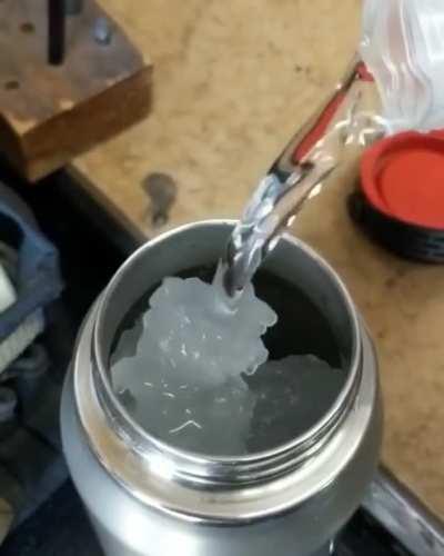 The water freezing as soon as it touches the container