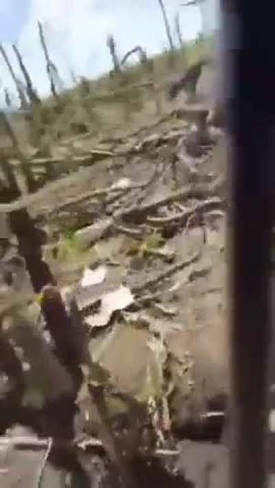 Russian POV as they walk past a graveyard of destroyed Russian equipment