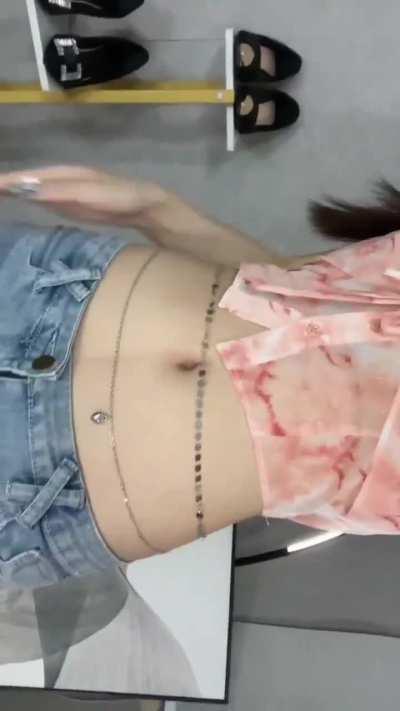 hot girl with belly chains plays with her navel