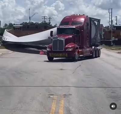 Trying to beat the train hauling a wind turbine blade?