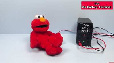 An Elmo toy under high voltage 