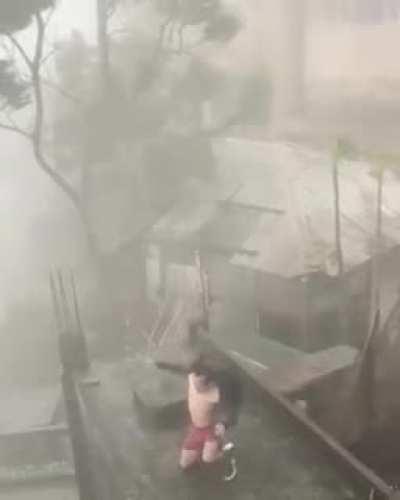 Guy dancing in the middle of a hurricane