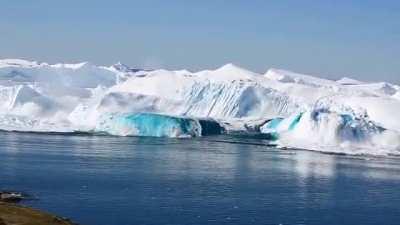 Amazing footage of a newly calved iceberg flipping in the Ilulissat Icefjord, Greenland.