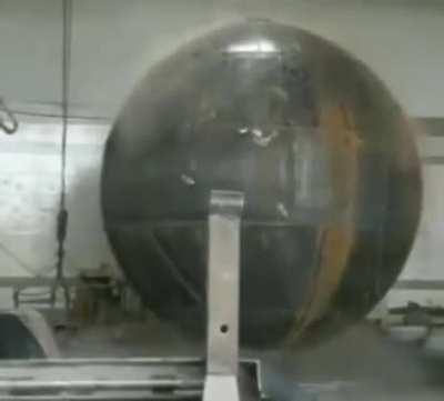 Metal Being Explosively Hydroformed Into A Steel Sphere