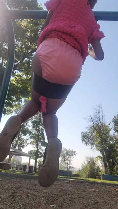 Wearing cloth diaper on swings at park