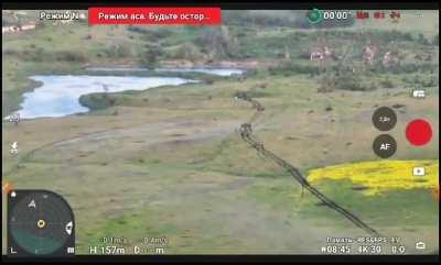 Russian drone operator attempts to unstuck his tank column from a minefield. 