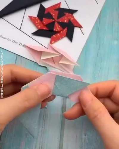 Making origami throwing stars.