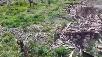 African mercenary of the Russian army fighting against a Ukrainian drone with a stick