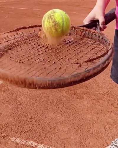 Getting rid of the sand on this tennis racket