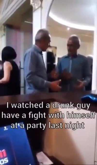 A drunk guy have a fight with himself at a party