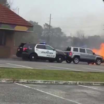 Police Officer Pushes Burning Car With His SUV Saving Building