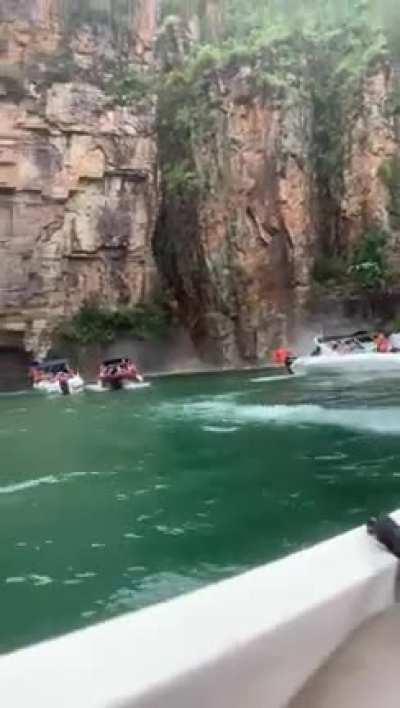 Riding boats near old rock structures