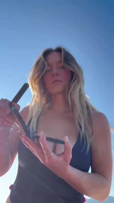 Sydney Sweeney putting makeup 