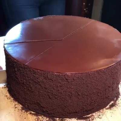 Cutting a slice from this multilayered cake