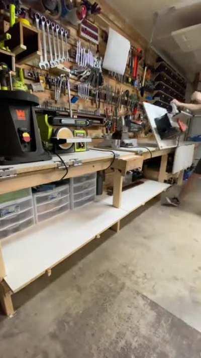 I made a workbench that allows me to have my tools flip down out of the way when I don’t need them