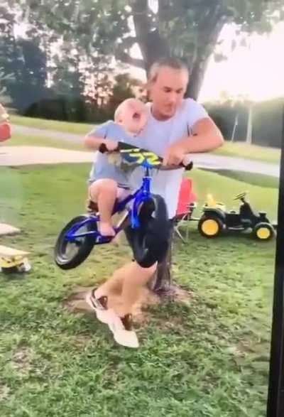 Dad helping his little guy feel the moment