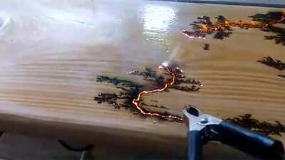 Electricity finding the path of least resistance on a piece of wood