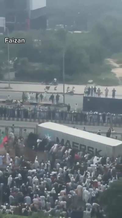 People in Pakistan removing containers with their bare hands to reach capital city to protest against fascist regime 