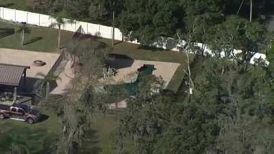 The homeowner in Florida has gun shaped pool in their backyard