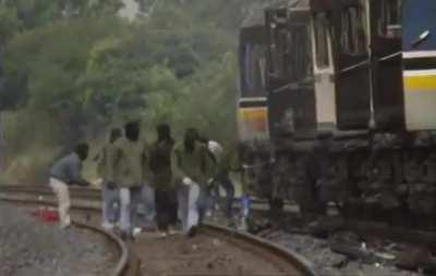 Volunteers Burn British train in response to a loyalist March in a nationalist area. Lurgan 1997.