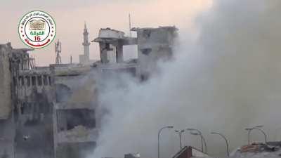 FSA &quot;Hell Cannon&quot; repeatedly batters the sandbagged husk of a Syrian Army fighting position - Aleppo - 2014