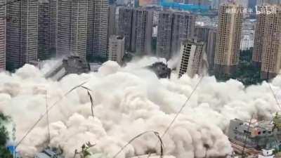 Blowing up 15 empty condos at once due to abandoned housing development