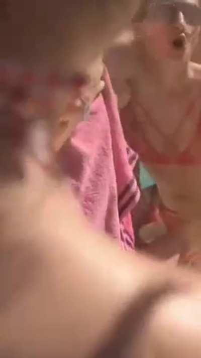 Friends help her strip naked at the pool party