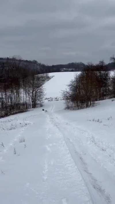 Learning how to ride on a sled for the first time