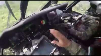 Colombian army Blackhawk takes a rifle round to the windshield during extraction in jungle (shot is at 0:27)