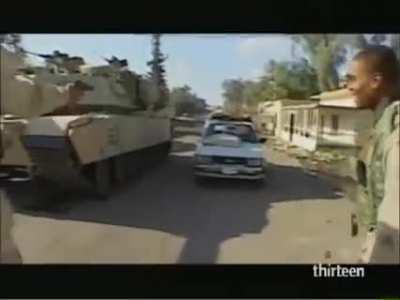 A great example of how to turn a group of civilians into the enemy. | U.S M1 Abrams crushes a Iraqi civilian's car.