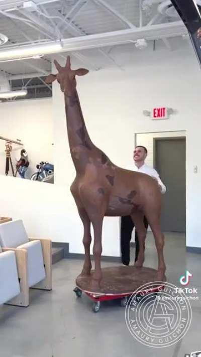 Life-sized giraffe made of chocolate.