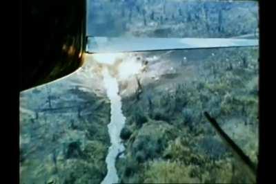 North American F-100D Super Sabre scores a direct hit on a bridge with a Mk 82 Snake Eye retarded 500 pound bomb during the Vietnam War