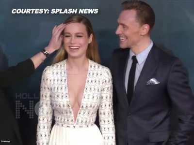 Brie Larson catches Tom Hiddleston staring at her cleavage.