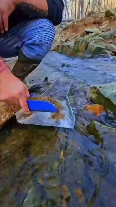 Using a sluice to find gold