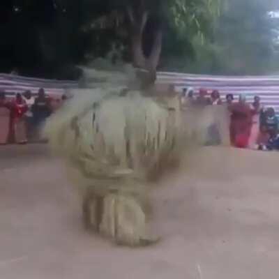 The Zangbeto is a ritualistic Gambian dance wherein the dancer is cloaked in palm fronds from head to toe