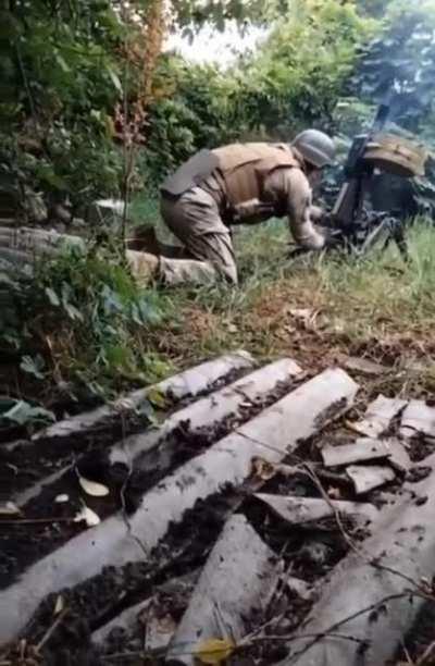 Ukrainian soldier firing an AGS-17 grenade launcher as a mortar 🤘🇺🇦