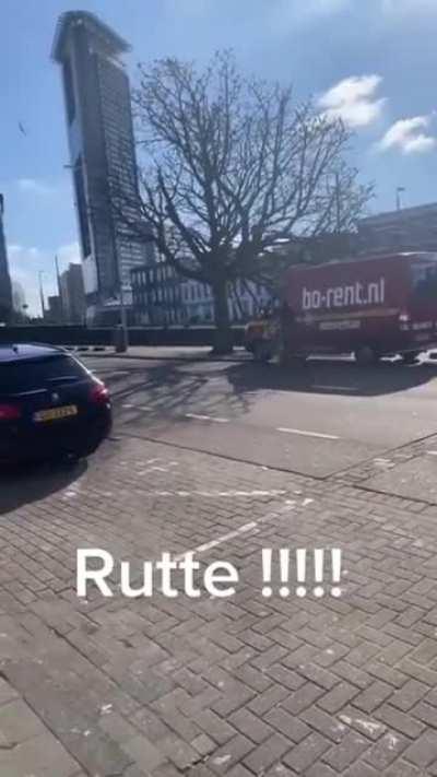 Dutch prime minister Mark Rutte casually answers civillians question while riding his bike through Amsterdam