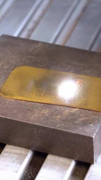 Using a laser to engrave a QR code on a 1 oz gold bar