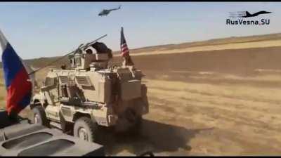 American M-ATV and MaxxPro MRAP being overtaken by Russian vehicles in NE Syria