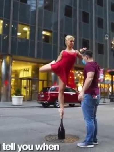 Ballerina balancing on a champagne bottle!